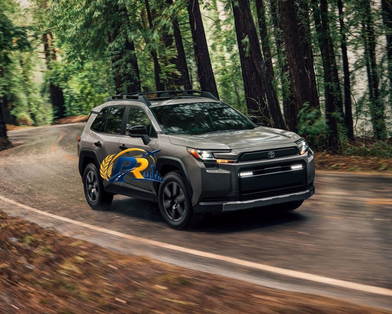 A silver Toyota RAV4 Hybrid driving along a tree-lined road